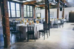 Loft Wedding Venue set up for reception with gold accents