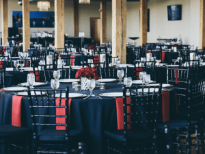 A large room with many tables and chairs.